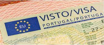 A close-up of a Portuguese visa document featuring a European Union emblem, with the words "VISTO/VISA PORTUGAL/PORTUGA" prominently displayed against a patterned background.