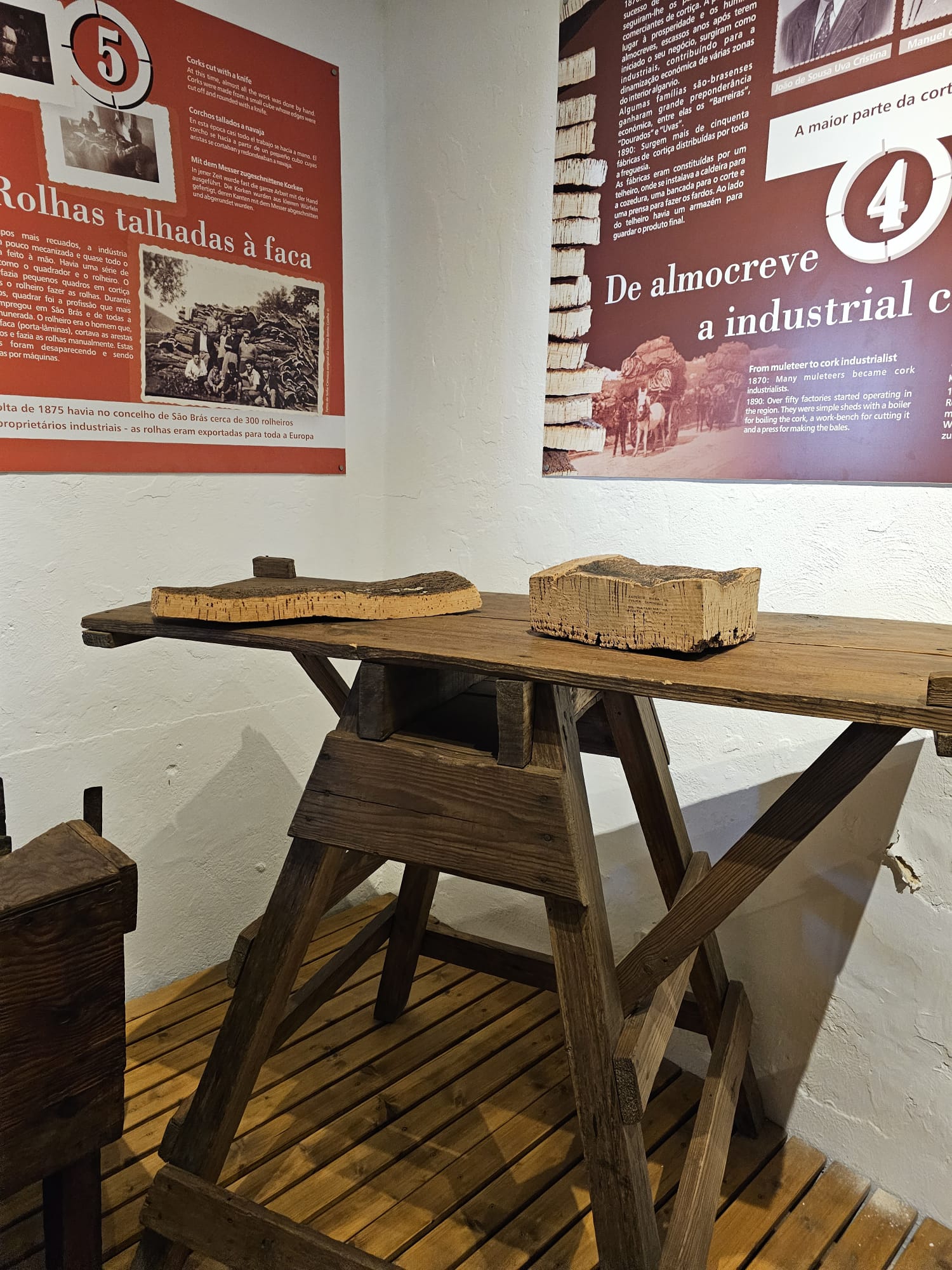 Traditional workbench and tools used to press and shape cork stoppers at a cork museum in Portugal