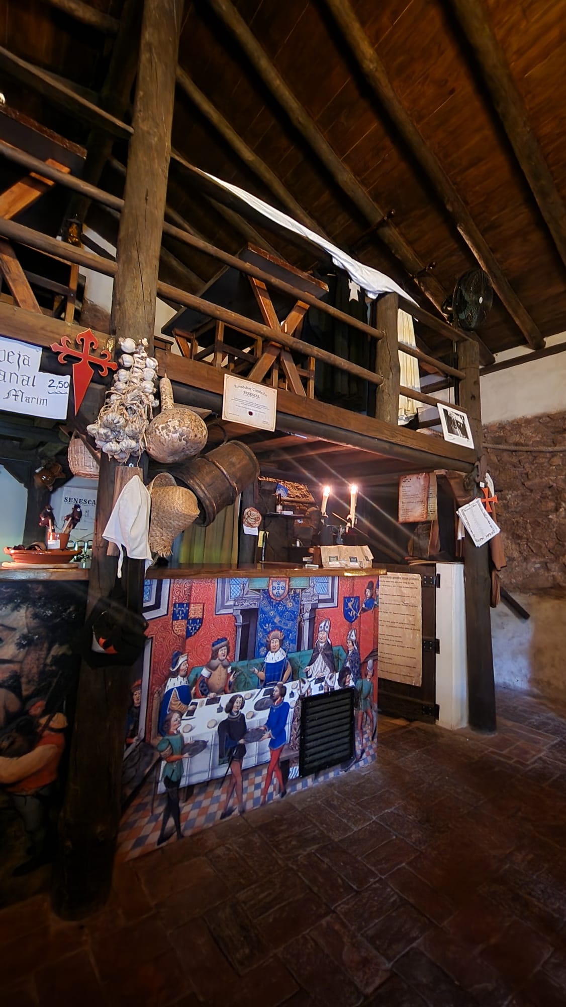 Rustic interior of a medieval style tavern at Castro Marim Portugal with wooden beams and traditional decor