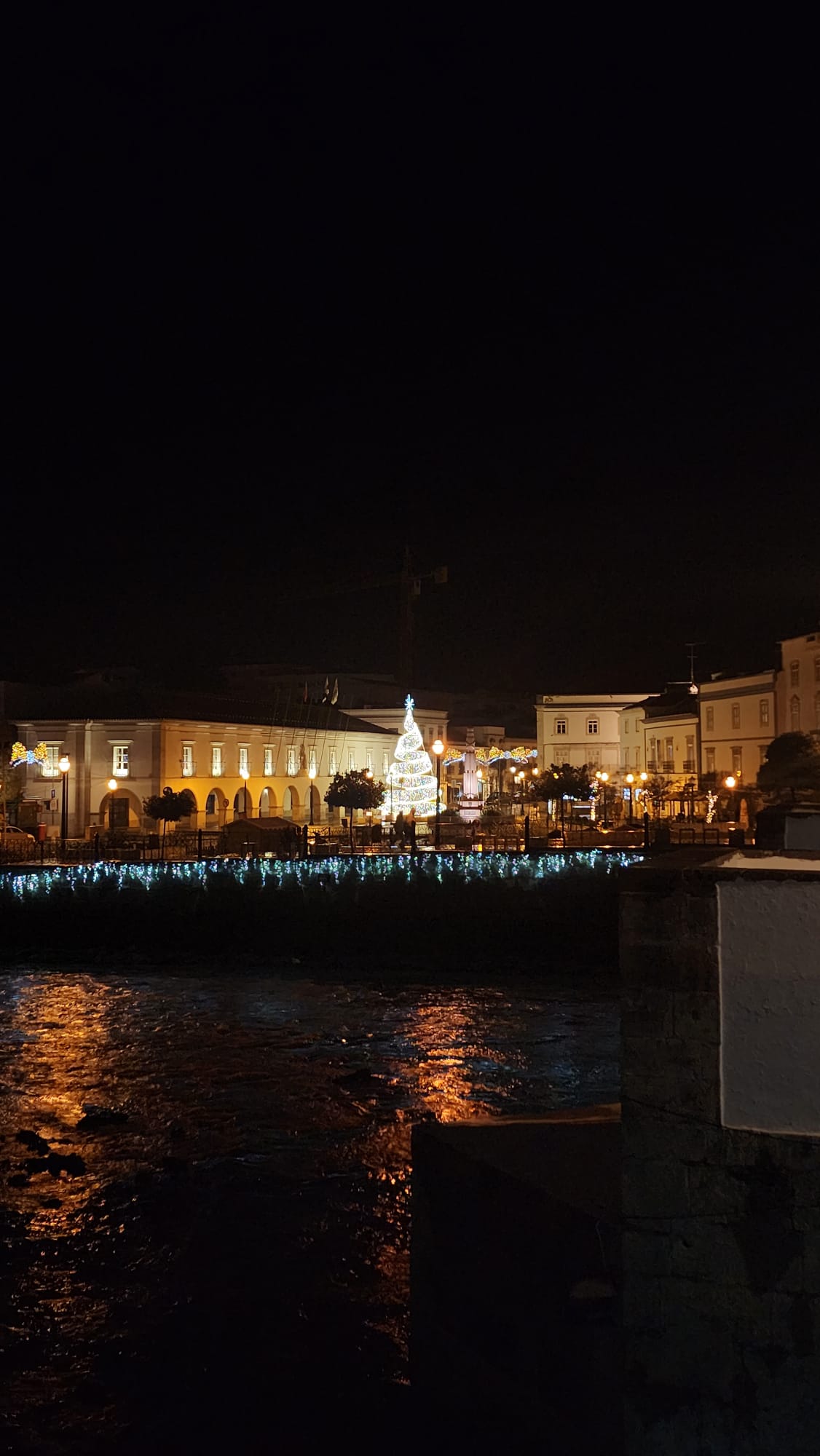 Tavira Portugal town center illuminated with Christmas lights and decorations at night