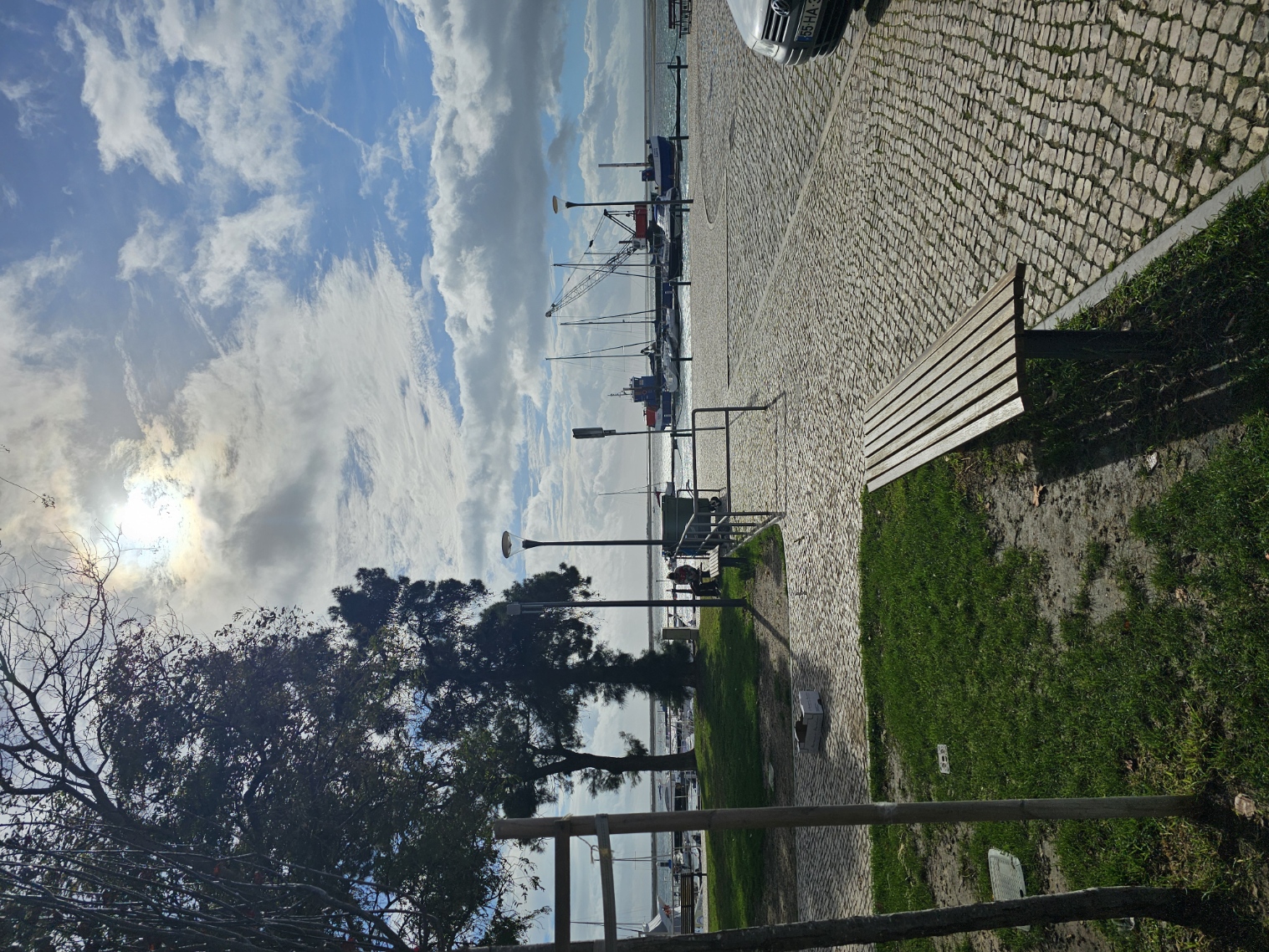 Waterfront promenade overlooking the Ria Formosa lagoon and fishing boats in Olhão Portugal