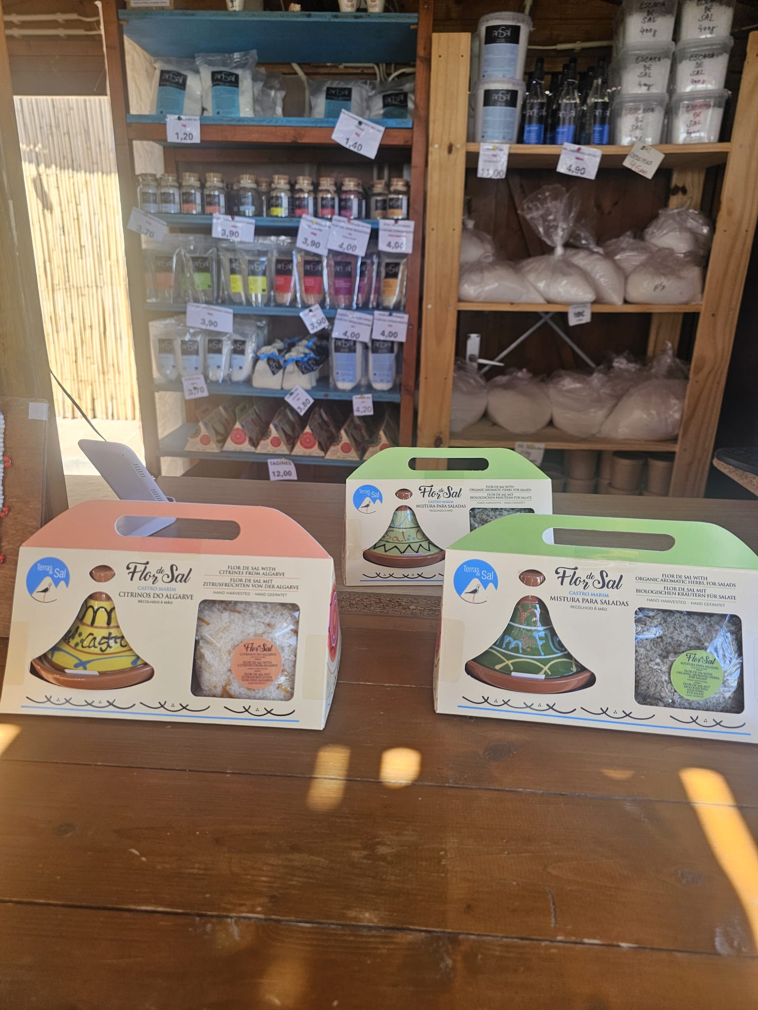 Display of artisanal Flor de Sal salt products and colorful bottled salts for purchase at Spa Salino in the Algarve, Portugal