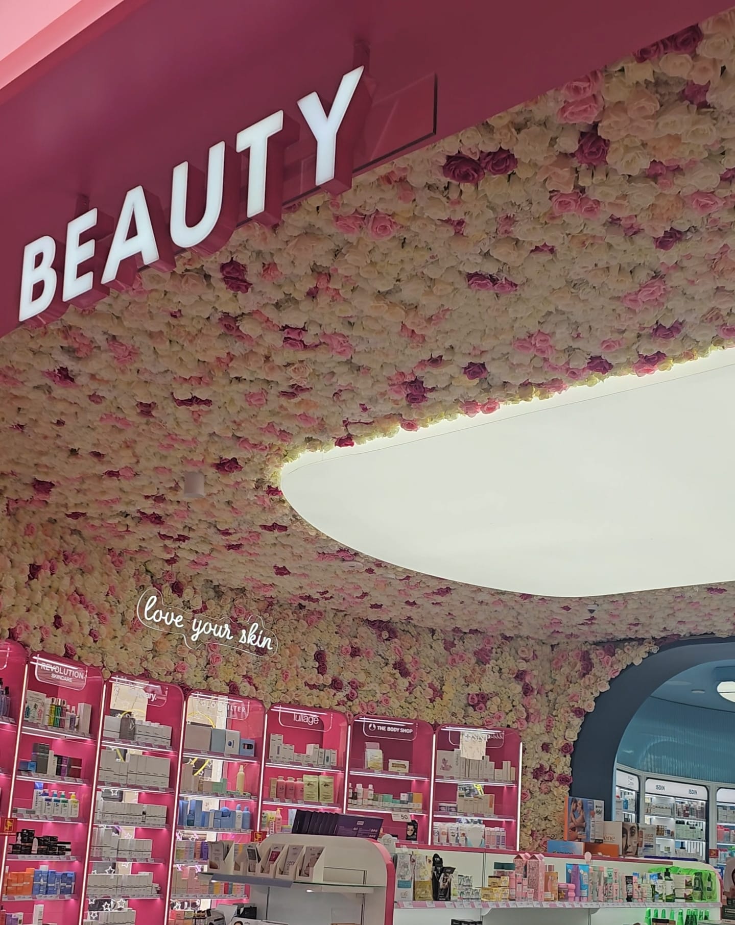 a pink flower ceiling at a beauty store