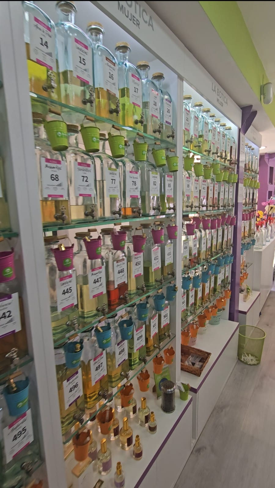 rows of numbered perfume bottles at a create-your-own perfume shop
