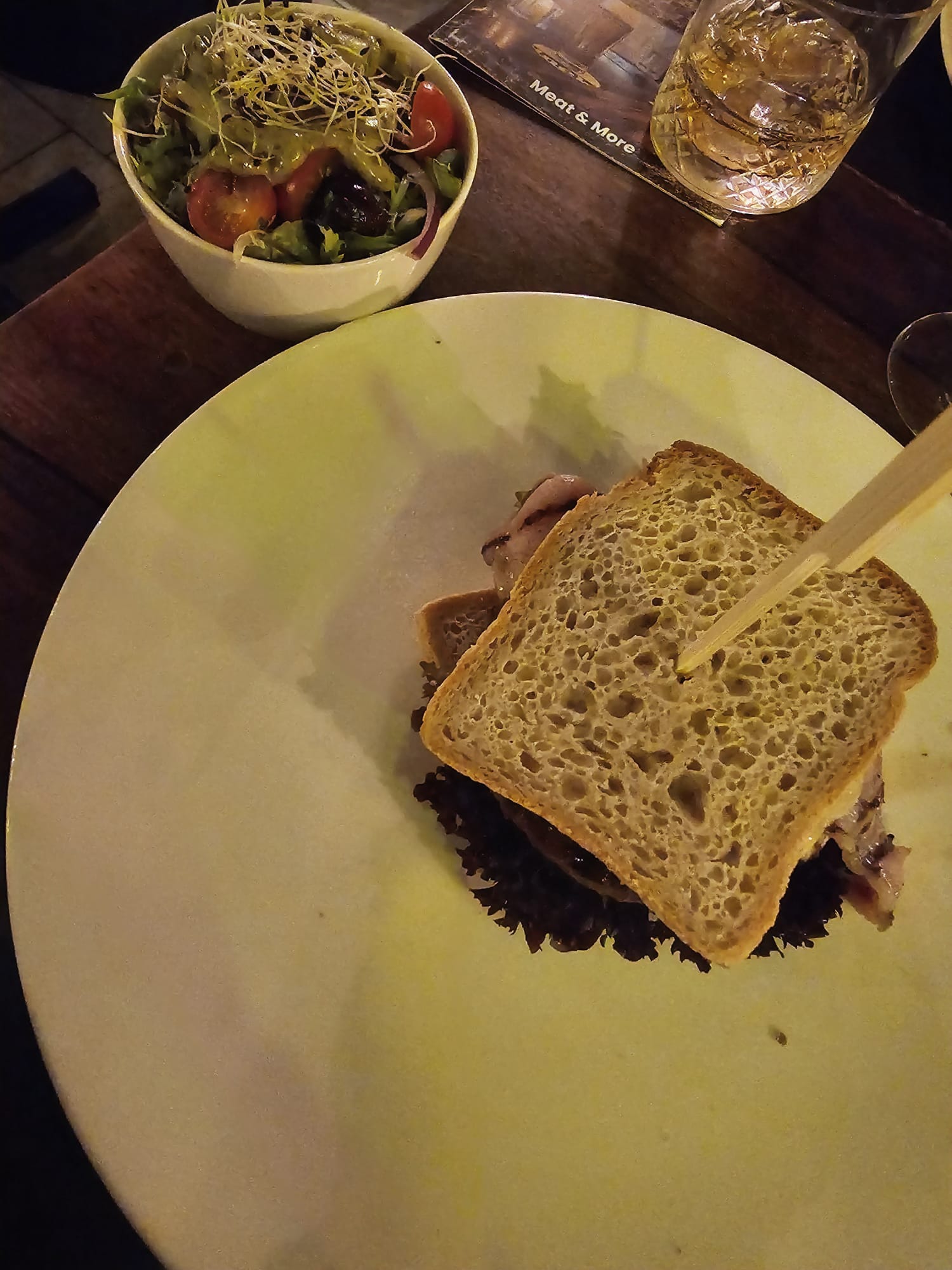 A burger served on toasted gluten-free bread slices instead of a bun.