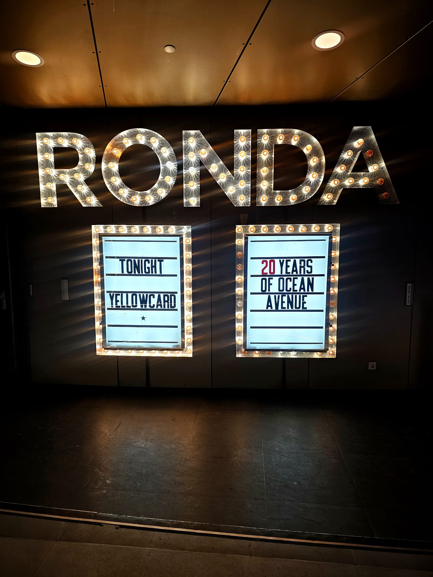 Illuminated marquee sign at Ronda venue in Utrecht announcing a Yellowcard 20 Years of Ocean Avenue concert