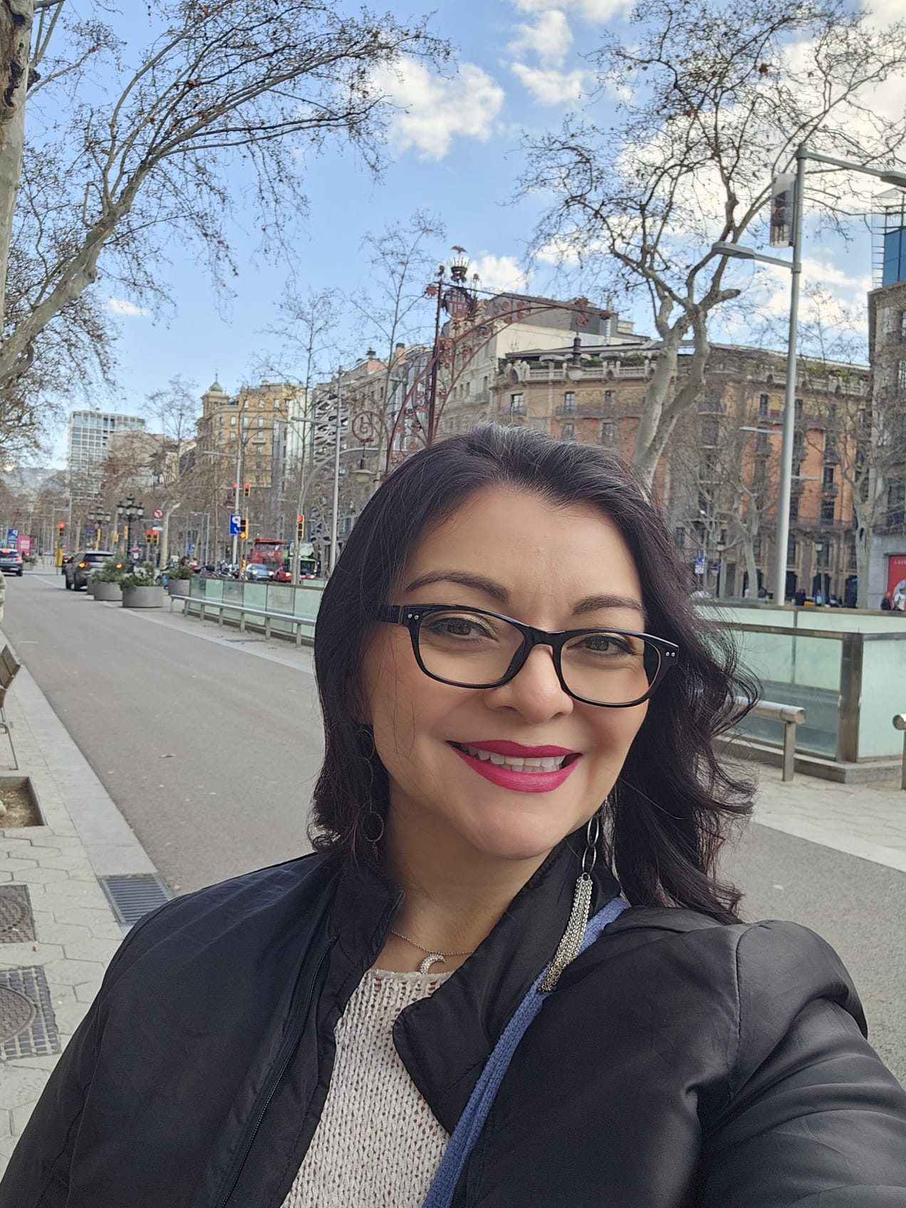 A woman smiling in the streets of Barcelona