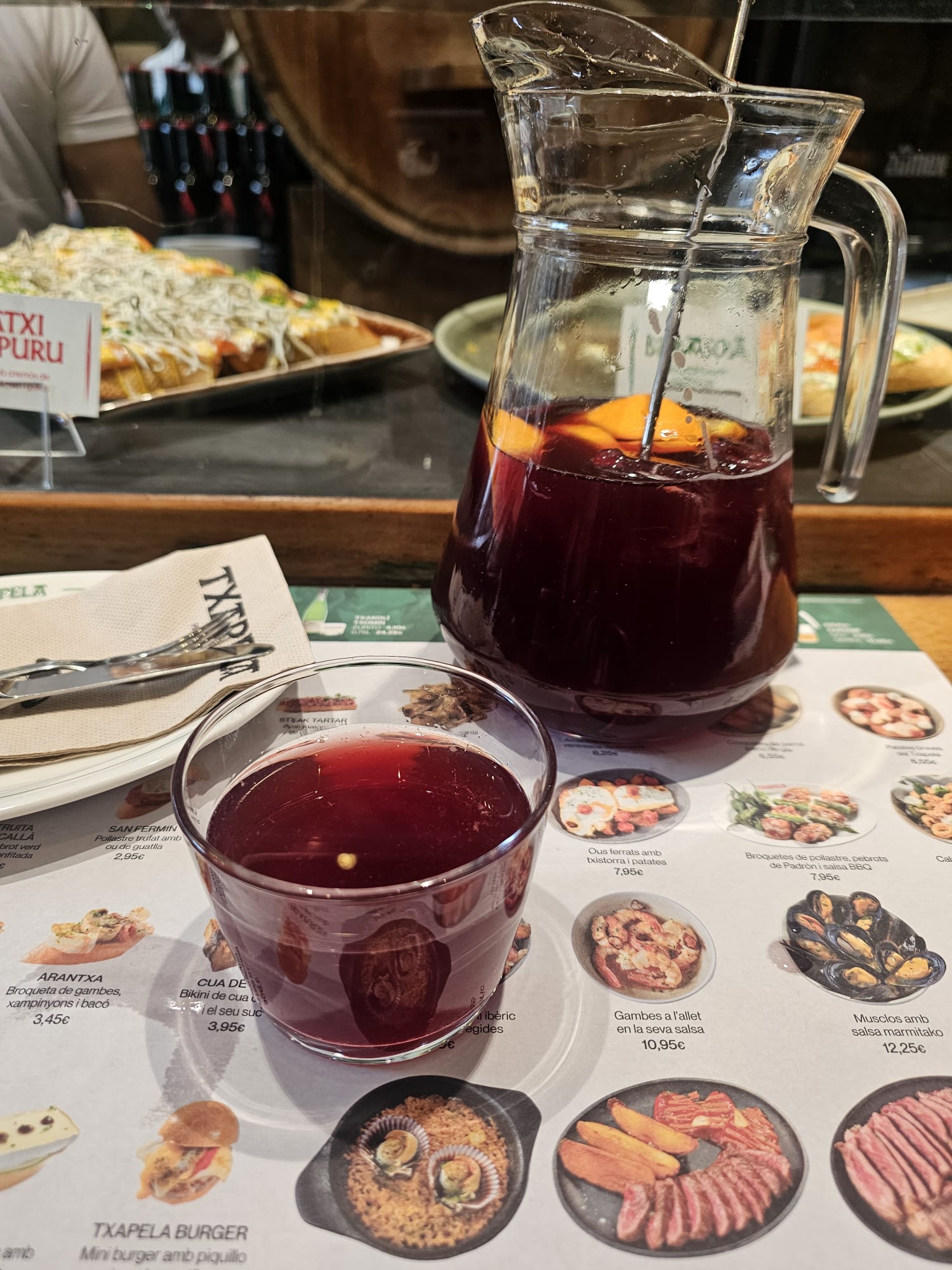 A pitcher and a glass of sangria 