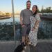 Couple and their beagle posing on the Roman Bridge in Tavira Portugal at sunset